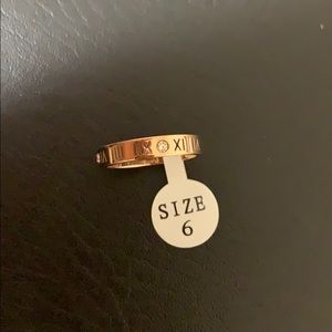 Rose gold Roman numerical ring with diamonds